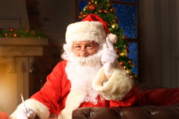 Portrait of Santa Claus answering Christmas letters.