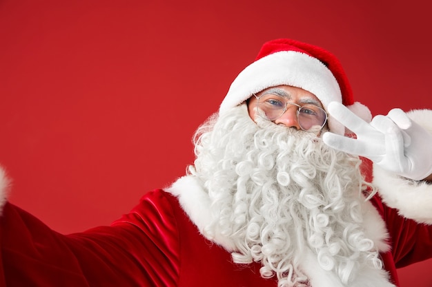 Portrait of Santa Claus taking selfie