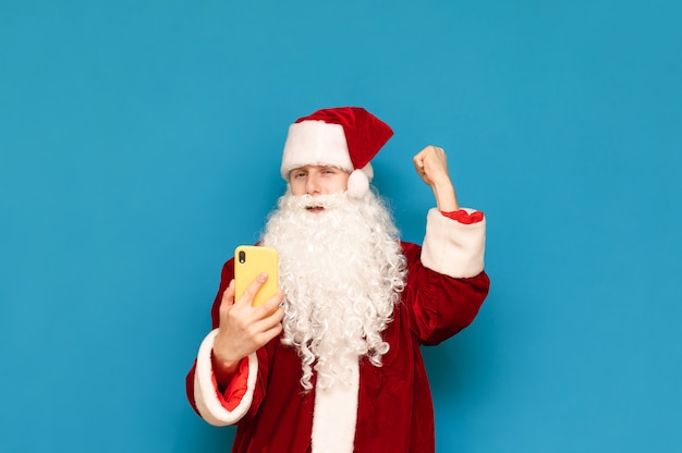 Portrait of Santa Claus with mobile