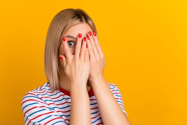 Portrait of scary frightened lady look in camera hide face palms isolated vivid color background