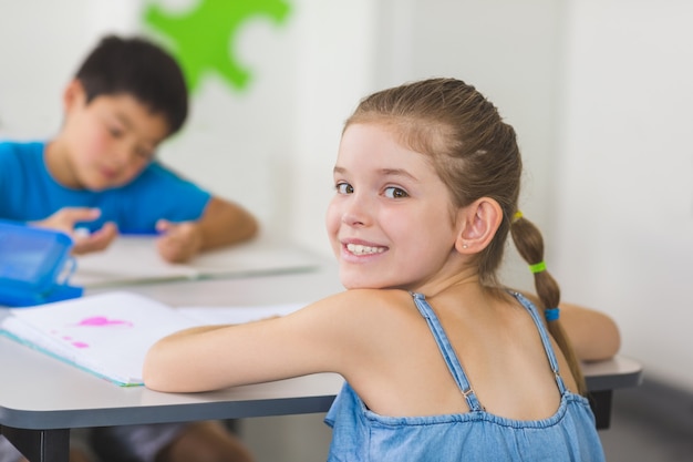 Portrait of schoolgirl in classroom