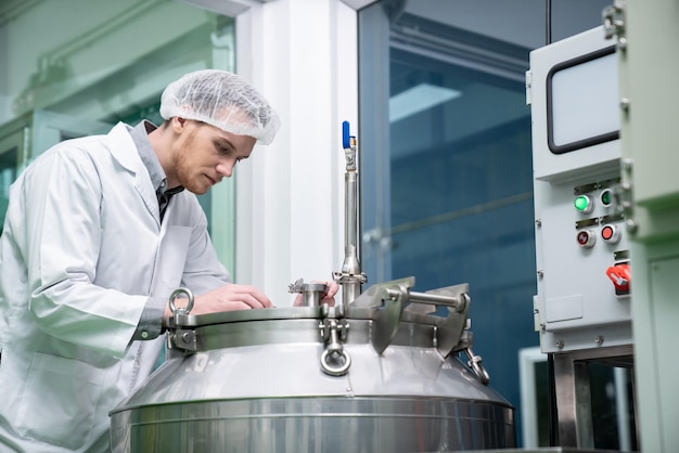 Portrait of a scientist apothecary extracting cannabis oil in laboratory