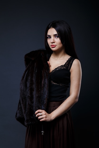 Portrait of a seductive lady in fur coat