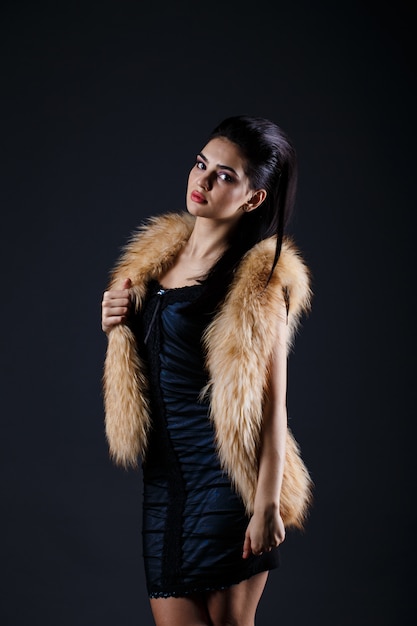 Portrait of a seductive lady in fur coat