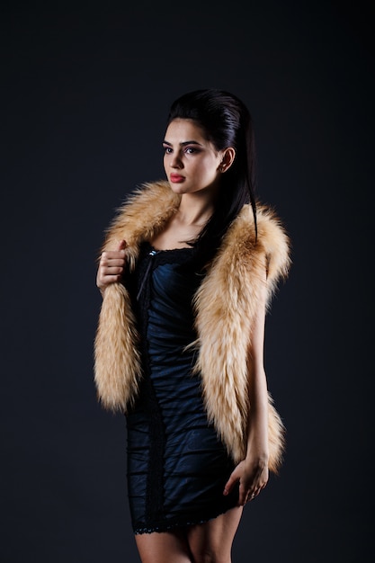 Portrait of a seductive lady in fur coat