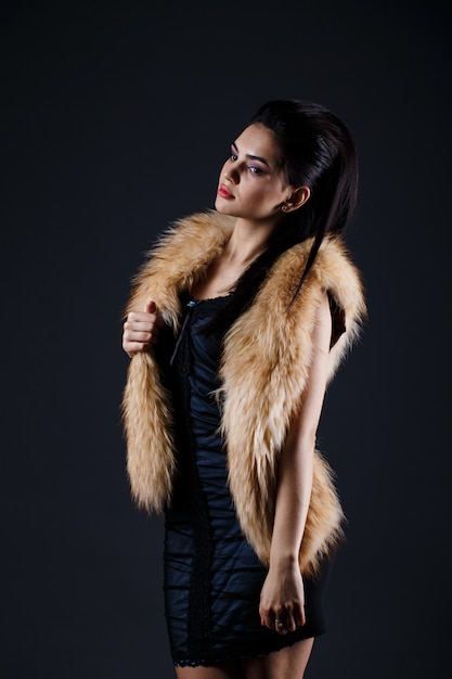 Portrait of a seductive lady in fur coat