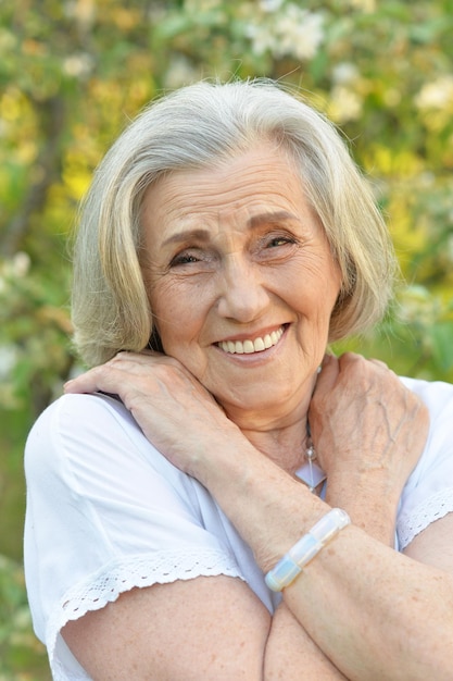 Portrait of senior beautiful woman in spring park