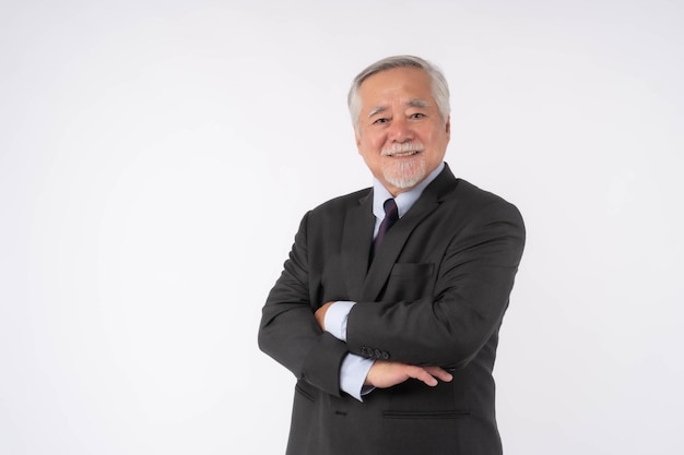 Portrait of a senior business man Asian senior man old man feel happy good health standing arms crossed isolated on white background lifestyle senior male concept