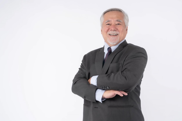 Portrait of a senior business man with suit Asian senior man old man feel happy good health standing arms crossed isolated on white background lifestyle senior male concept