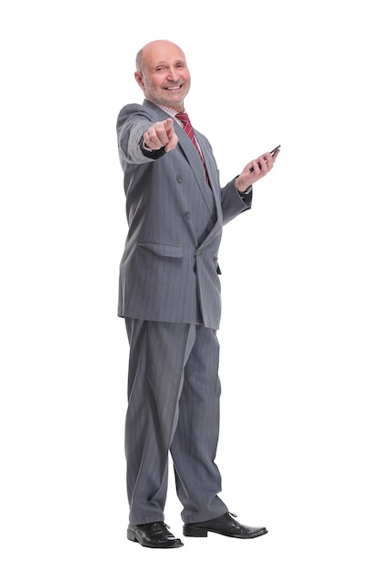 Portrait of a senior businessman sending a message on his cellphone