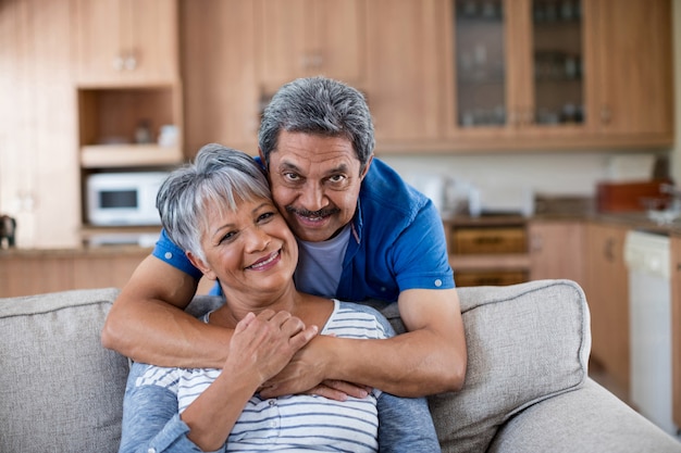 Portrait of senior couple embracing each other