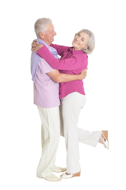 Portrait of senior couple posing isolated on white background