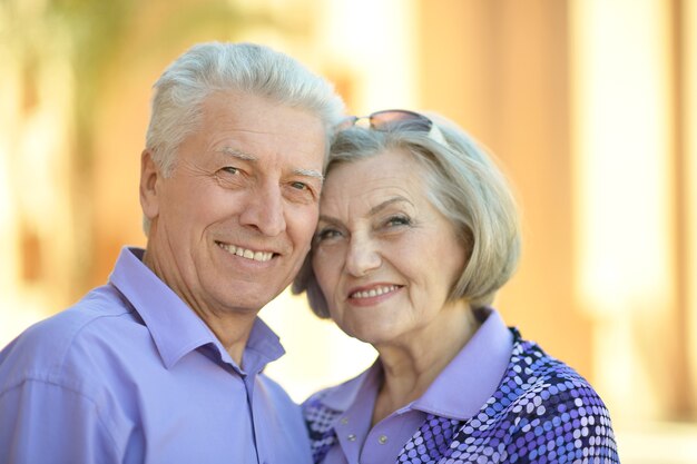 Portrait of a senior couple relaxing near  hotel resort