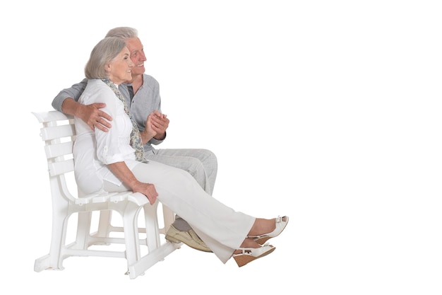 Portrait of senior couple sitting on bench