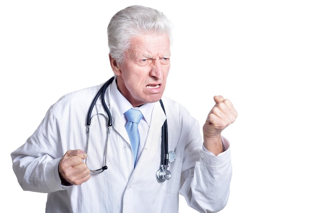 Portrait of a senior male doctor isolated on white background