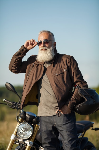 Portrait of a senior man outdoors. Old biker portrait.