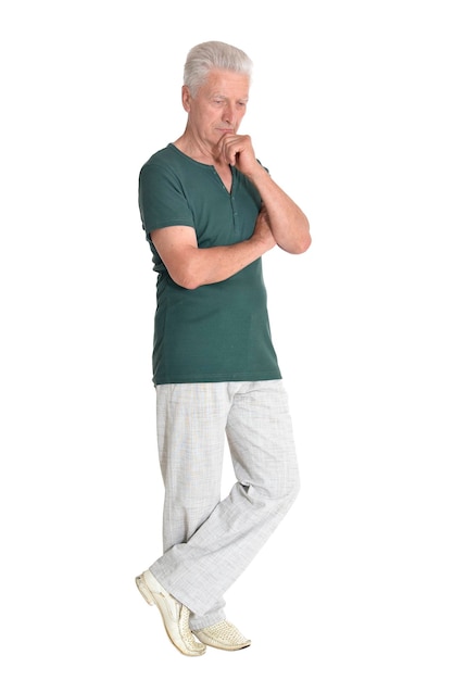 Portrait of senior man posing on white background full length