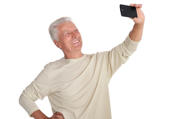 Portrait of senior man taking selfie