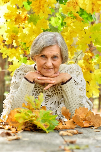 Portrait of senior woman in autumn park