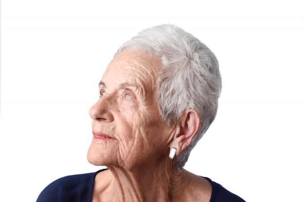 Portrait of a senior woman on white background