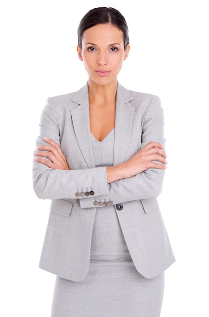 Portrait serious and business woman with arms crossed in studio isolated on a white background Confidence professional agent or entrepreneur with pride for career job or employee working in Spain