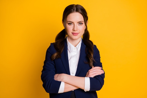 portrait of serious charming high school girl cross hands