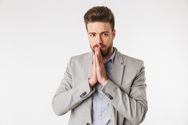 Portrait of a serious young man dressed in shirt and jacket