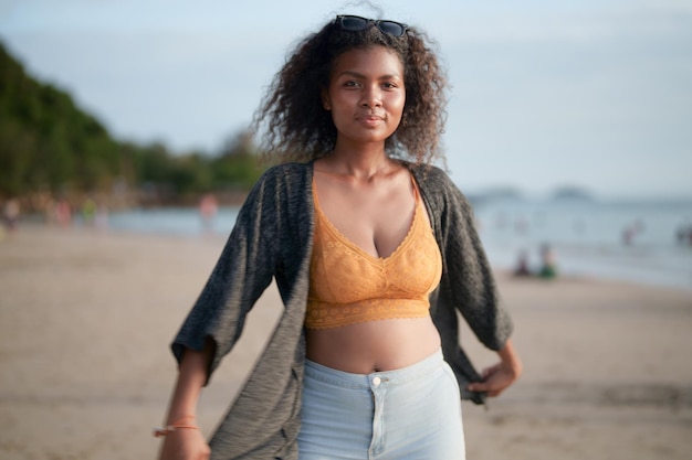 Portrait sexy Asian African lady standing and relaxing at beach The summer time at the sea and beach