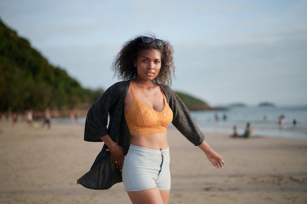 Portrait sexy Asian African lady standing and relaxing at beach The summer time at the sea and beach