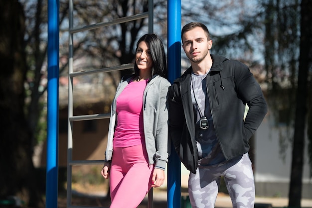 Portrait Of A Sexy Couplein in City Park Area  Training and Exercising for Endurance  Healthy Lifestyle Concept Outdoor