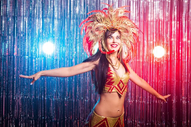 Portrait of a sexy female in a colorful sumptuous carnival costume