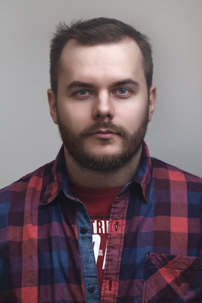 Portrait not the shaven man on a gray background