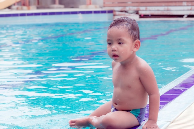 Portrait of shirtless boy in swimming pool