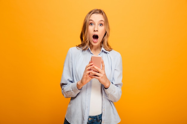 Portrait of a shocked young girl with braces