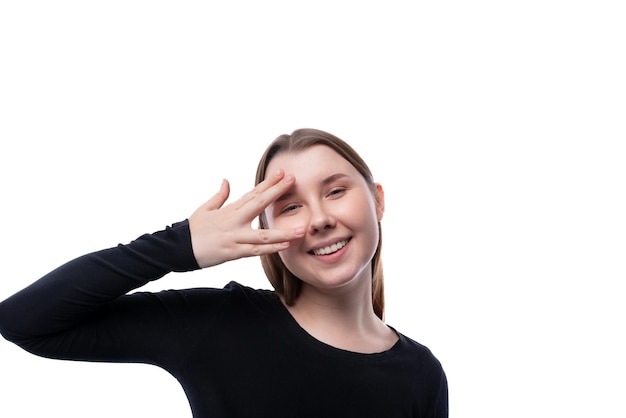 Portrait of a shy preteen girl of european appearance on a white background