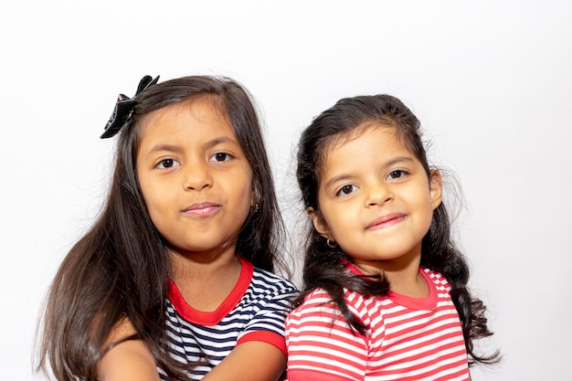 Portrait of siblings against white background