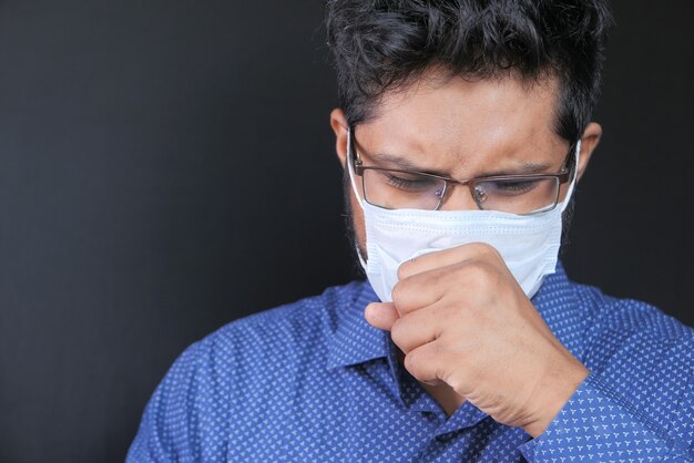 Portrait of sick man sneezes and coughs,