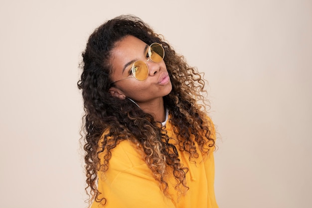 Portrait of smiley teenage girl wearing sunglasses