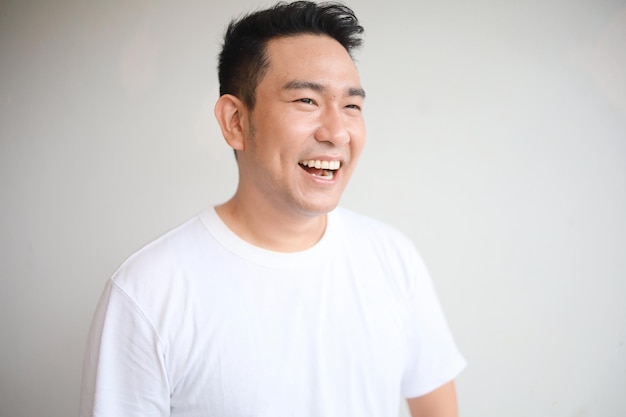 Portrait smiling Asian man over white background