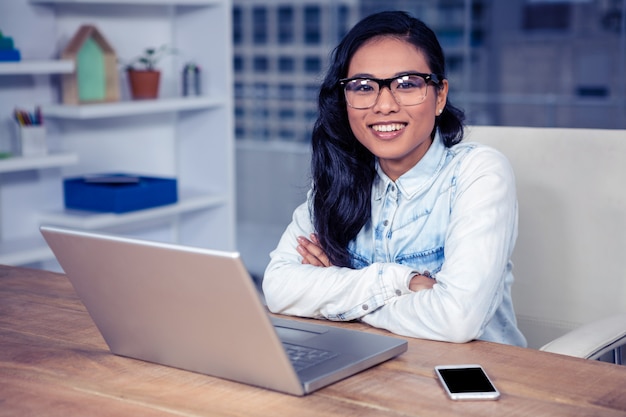 Portrait on smiling Asian woman in office