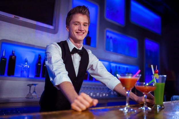 Portrait of smiling bartender standing