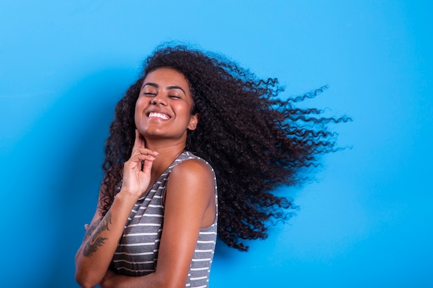 Portrait of smiling black woman with afro hairstyle    