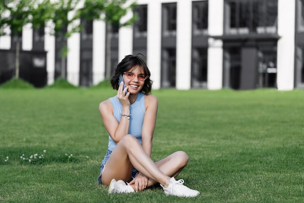 Portrait of a smiling Business woman Using iPhone 13 pro