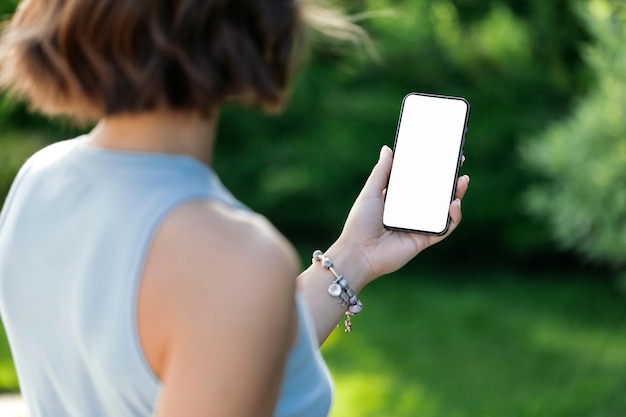 Portrait of a smiling Business woman Using iPhone 13 pro