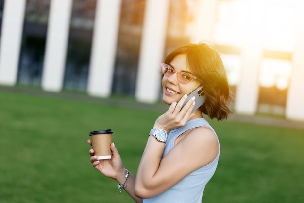 Portrait of a smiling Business woman Using Phone