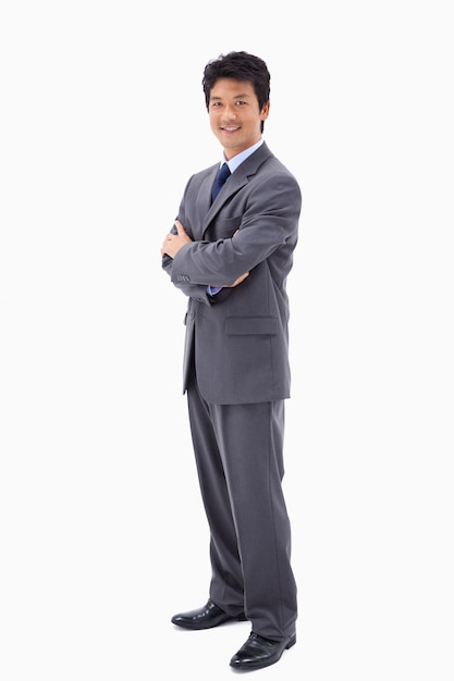 Portrait of a smiling businessman with the arms crossed