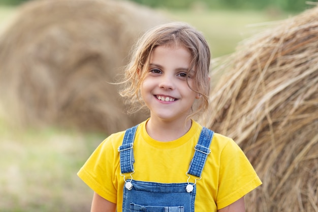 portrait of a smiling child in field