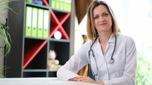 Portrait of smiling female doctor with stethoscope in clinic happy young female therapist or