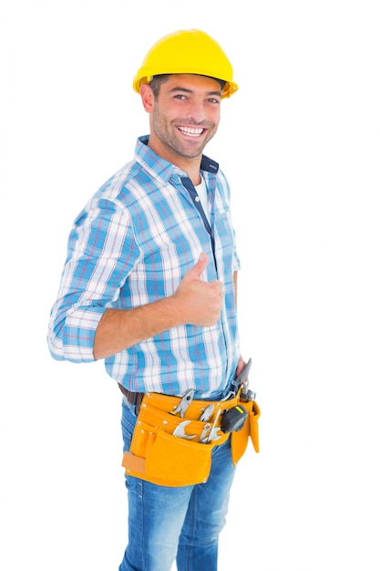 Portrait of smiling handyman gesturing thumbs up