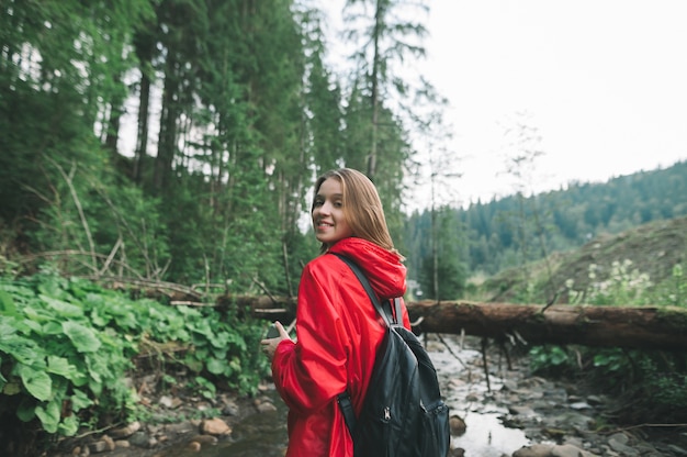 Portrait of smiling hiker girl hiking